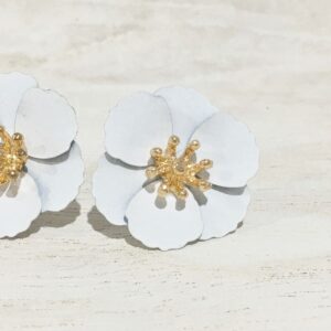 white petal stud earrings with gold accents