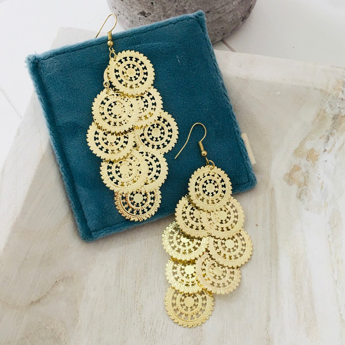 gold dangling earrings with 8 intricate circles in each earrings
