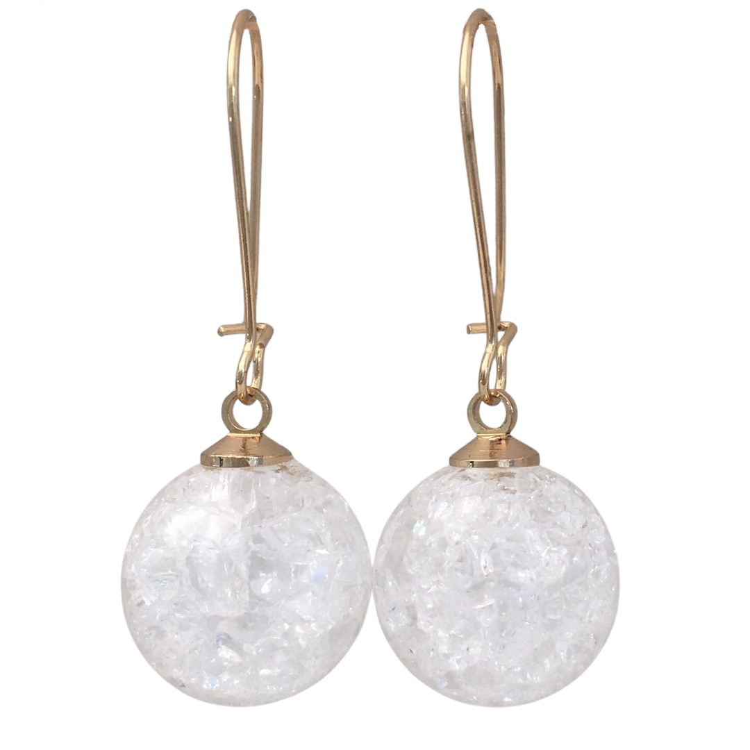 white earrings in gold tone