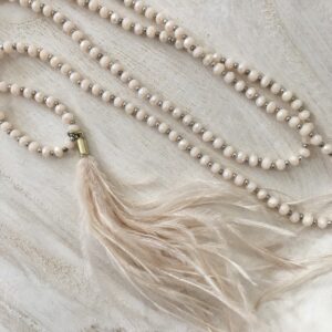 soft pink crystal necklace with feathers