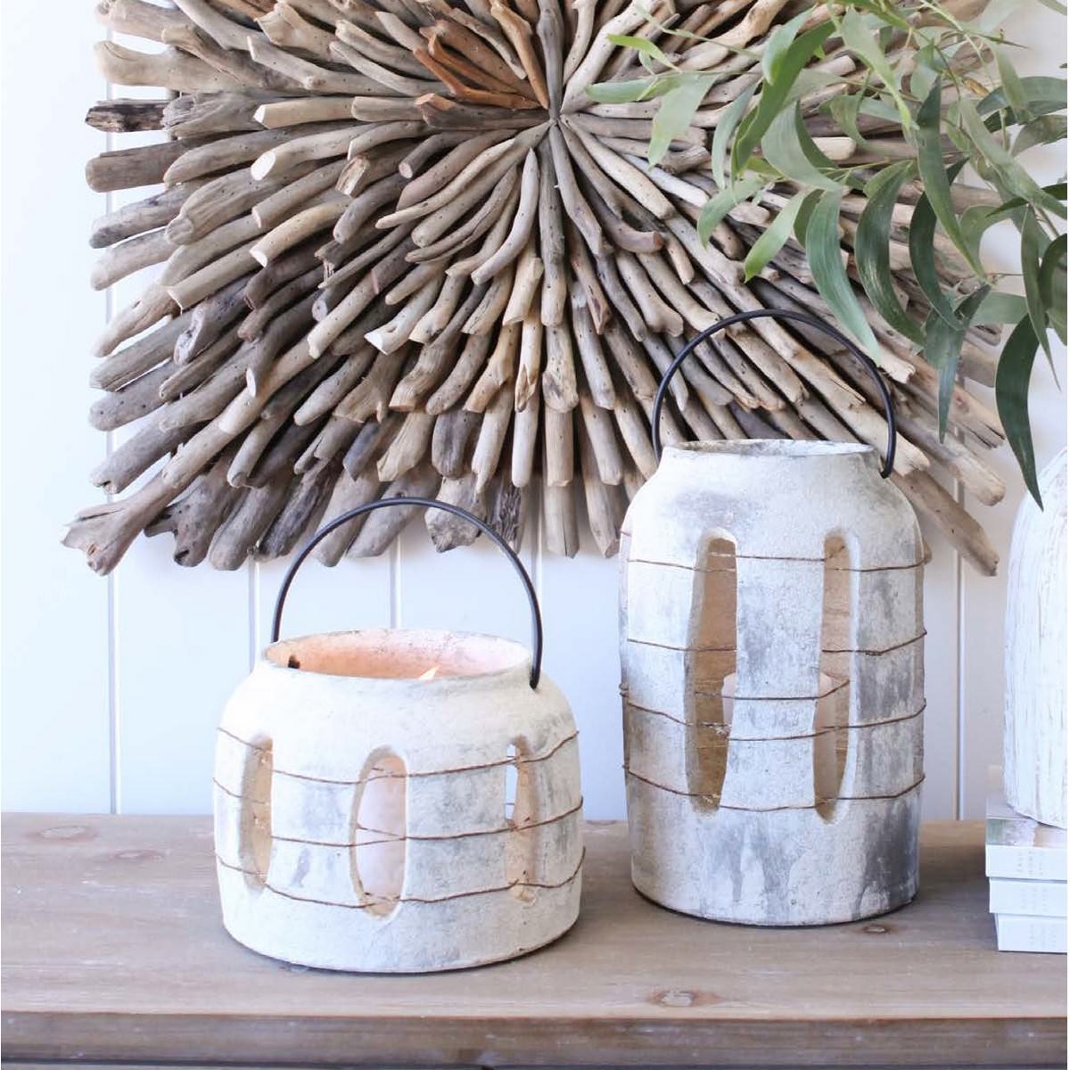 Weathered ceramic lantern with metal handle
