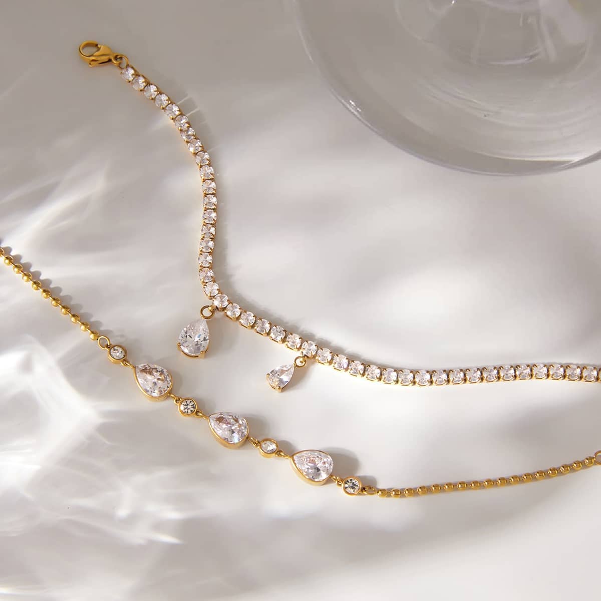 18k gold plated crystal tennis bracelet with teardrop charms
