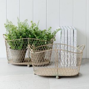 set of 2 oval wire baskets with handles, and a distressed rustic finish