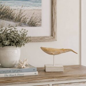 resin whale sculpture on stand